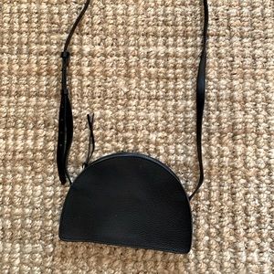 The Simple Half-Moon Crossbody Bag in Black